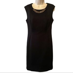 Calvin Klein navy crew neck sheath dress with attached gold chain. Size 8P.